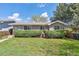 Charming single-story home with a well-maintained lawn and mature trees, offering great curb appeal at 200 Perry St, Denver, CO 80219