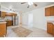 Open-concept kitchen with stainless steel appliances, tile flooring, and ample cabinet space at 200 Perry St, Denver, CO 80219