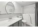 Bright bathroom featuring a walk-in tub, modern vanity, and an oval mirror at 12115 Bannock St # B, Denver, CO 80234