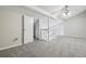 Bonus room featuring high ceilings with a fan, neutral walls, and soft carpet at 12115 Bannock St # B, Denver, CO 80234