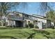 Charming home exterior boasts a lush lawn and a small deck for outdoor enjoyment at 12115 Bannock St # B, Denver, CO 80234