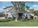 Two-story home with a blue-gray exterior, balcony, and well-maintained lawn and landscaping at 12115 Bannock St # B, Denver, CO 80234
