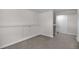 Finished basement featuring neutral carpet and paint at 6103 Uno St, Arvada, CO 80003