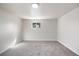Basement bedroom with neutral walls and carpet, and a window for natural light at 6103 Uno St, Arvada, CO 80003