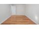 Bedroom featuring neutral paint, hardwood floors and a doorway at 6103 Uno St, Arvada, CO 80003