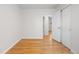 Spacious bedroom with hardwood floors and closet featuring double doors at 6103 Uno St, Arvada, CO 80003