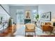 Bright living room features hardwood floors, fireplace, and sliding door to the outdoors at 1777 S Union Blvd, Lakewood, CO 80228