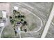 Birds-eye view of acreage with house, horse track, and stables; rural charm meets modern amenities at 2781 Savage Rd, Elizabeth, CO 80107