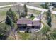 Back aerial view with patio, mature trees; outdoor living with comfort and style at 2781 Savage Rd, Elizabeth, CO 80107