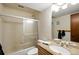 Bathroom featuring a shower-tub, granite-topped vanity, and neutral tile for a clean and modern design at 2781 Savage Rd, Elizabeth, CO 80107