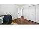 Bedroom with wood floors, white walls, doors to other rooms, and lots of open space at 2781 Savage Rd, Elizabeth, CO 80107