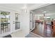 Entryway features tile floors, glass doors leading to deck, open door into living room with hardwood floors at 2781 Savage Rd, Elizabeth, CO 80107