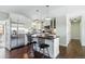 Modern kitchen featuring white cabinets, stainless steel appliances, and a convenient island at 2781 Savage Rd, Elizabeth, CO 80107