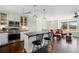 Stylish kitchen with a center island and a cozy sitting area with large sunlit windows at 2781 Savage Rd, Elizabeth, CO 80107
