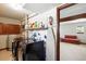 A well-equipped laundry room with modern appliances, storage shelves, and an ironing board for added convenience at 2781 Savage Rd, Elizabeth, CO 80107