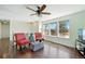 Cozy living room with hardwood floors and large windows providing ample natural light at 2781 Savage Rd, Elizabeth, CO 80107