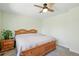 This Main Bedroom features two windows, a ceiling fan, side table, light green paint at 2781 Savage Rd, Elizabeth, CO 80107