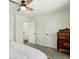 This Main bedroom has two doors, a dresser, and a ceiling fan with light green paint at 2781 Savage Rd, Elizabeth, CO 80107