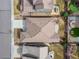 Birds-eye view of a well-maintained home showcasing roof detail, backyard design, and surrounding manicured landscapes at 14134 Glenayre Cir, Parker, CO 80134