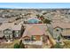 Inviting backyard with a covered patio, lush lawn, and tasteful landscaping, ideal for relaxation and entertaining at 14134 Glenayre Cir, Parker, CO 80134