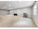 Finished basement featuring neutral carpet, recessed lighting, and egress windows for natural light at 14134 Glenayre Cir, Parker, CO 80134