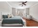 Bright bedroom with natural light, neutral colors, and a ceiling fan at 14134 Glenayre Cir, Parker, CO 80134