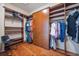 Spacious walk-in closet with custom shelving and wood cabinetry at 14134 Glenayre Cir, Parker, CO 80134