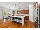 Spacious kitchen with a large center island, stainless steel appliances, and wood cabinetry at 14134 Glenayre Cir, Parker, CO 80134