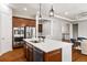 Bright kitchen featuring stainless appliances, a large island, and hardwood floors at 14134 Glenayre Cir, Parker, CO 80134