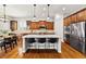 Bright kitchen with an island, stainless steel appliances, and a dining area with modern lighting at 14134 Glenayre Cir, Parker, CO 80134