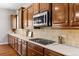 Modern kitchen with gas range, stainless microwave, and ample cabinet space at 14134 Glenayre Cir, Parker, CO 80134