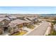 Charming brown two-story homes with landscaped yards line a neighborhood street with mountain views at 14134 Glenayre Cir, Parker, CO 80134