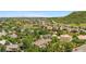 Aerial view of a neighborhood surrounded by lush greenery and rolling hills at 276 Ember Pl, Castle Rock, CO 80104