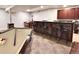 Basement bar area with seating, plus a pool table for entertainment at 276 Ember Pl, Castle Rock, CO 80104