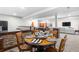 Basement dining area with table setting, bar, and view to living area at 276 Ember Pl, Castle Rock, CO 80104