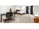 Comfortable bedroom with a black desk, a cozy bed, and carpeted floors at 276 Ember Pl, Castle Rock, CO 80104