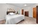 Neutral bedroom features a queen-sized bed, carpeted floor, and dresser at 276 Ember Pl, Castle Rock, CO 80104