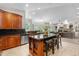 Well-appointed kitchen with a central island, stainless steel appliances, and a seamless connection to the living area at 276 Ember Pl, Castle Rock, CO 80104