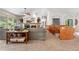 Spacious living room with a fireplace, vaulted ceilings, and large windows overlooking the backyard at 276 Ember Pl, Castle Rock, CO 80104