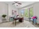 Sunlit home office with bay windows, a ceiling fan, and neutral walls at 276 Ember Pl, Castle Rock, CO 80104