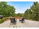 Outdoor patio with comfortable seating and serene views of the lush landscape at 276 Ember Pl, Castle Rock, CO 80104