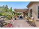 Spacious patio with a pergola, outdoor seating, and landscaped yard at 276 Ember Pl, Castle Rock, CO 80104