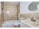 Bathroom featuring decorative tile surround, white fixtures, and a vanity at 3351 S Field St # 164, Lakewood, CO 80227