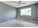 Bedroom with neutral walls, natural light, ceiling fan and carpeted flooring at 3351 S Field St # 164, Lakewood, CO 80227