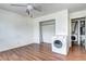 Bedroom with natural light, ceiling fan, and a laundry closet with washer and dryer hookups at 3351 S Field St # 164, Lakewood, CO 80227