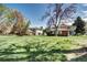 Exterior shot of building with grassy area and trees at 3351 S Field St # 164, Lakewood, CO 80227