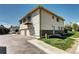 Charming two-story townhouse with a balcony, two car garage, and well-maintained lawn at 3351 S Field St # 164, Lakewood, CO 80227