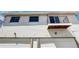 Exterior elevation featuring a balcony and garages at 3351 S Field St # 164, Lakewood, CO 80227