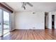 This living room features wood floors, ceiling fan, access to a deck, and abundant natural light at 3351 S Field St # 164, Lakewood, CO 80227