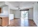 The living room boasts wood floors, natural light from the glass doors to a private deck at 3351 S Field St # 164, Lakewood, CO 80227